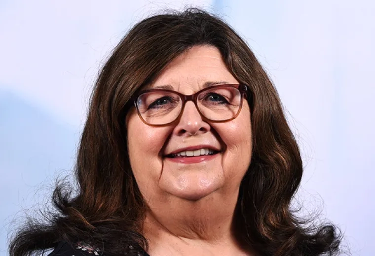 mary has shoulder length brown hair with curly flips at the end