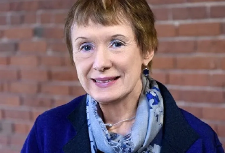 margie has close cropped reddish brown hair and light pink lipgloss