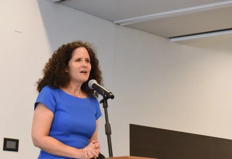woman talking at podium