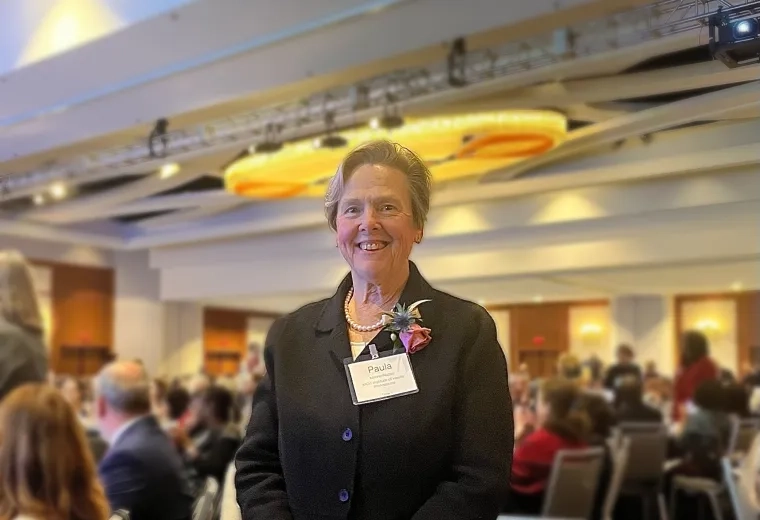 woman smiles and poses