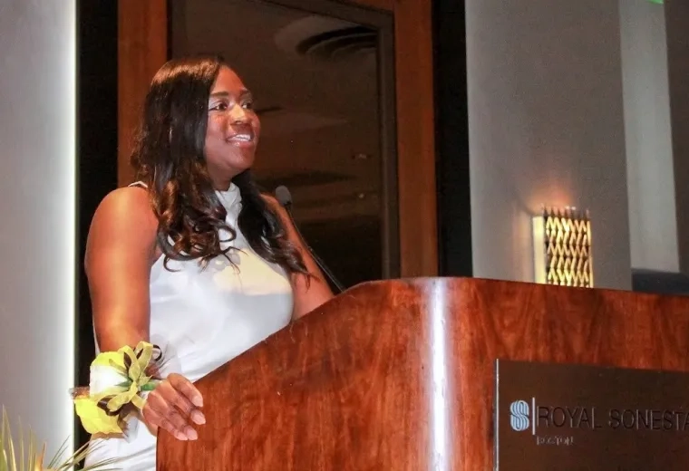 Woman speaking at a podium