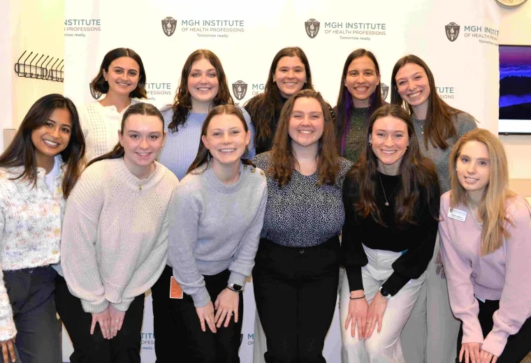 11 students in group smiling