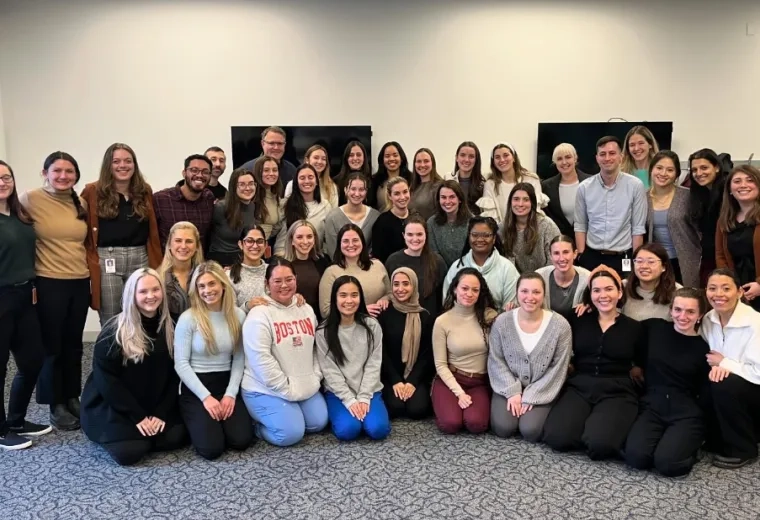 students pose and smile