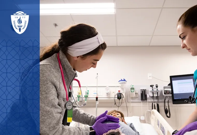 Nursing students at MGH IHP practicing hands-on skills in a simulation lab as part of the ABSN program.