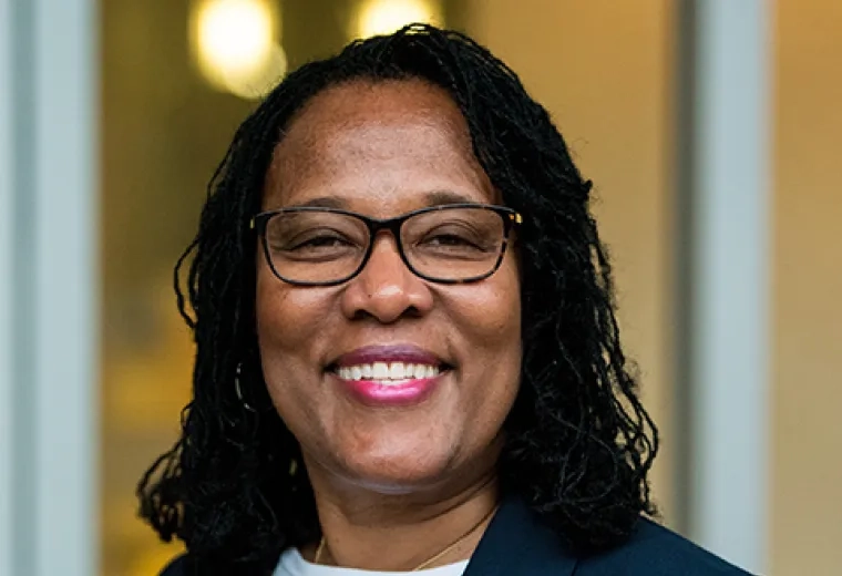 Guardia Banister in white shirt and black blazer