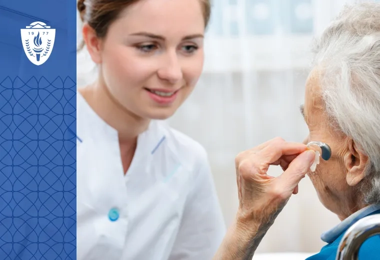 woman with grey hair holds a hearing aid up to her ear while a woman in a lab coat looks on