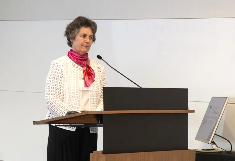 Woman speaking at podium 
