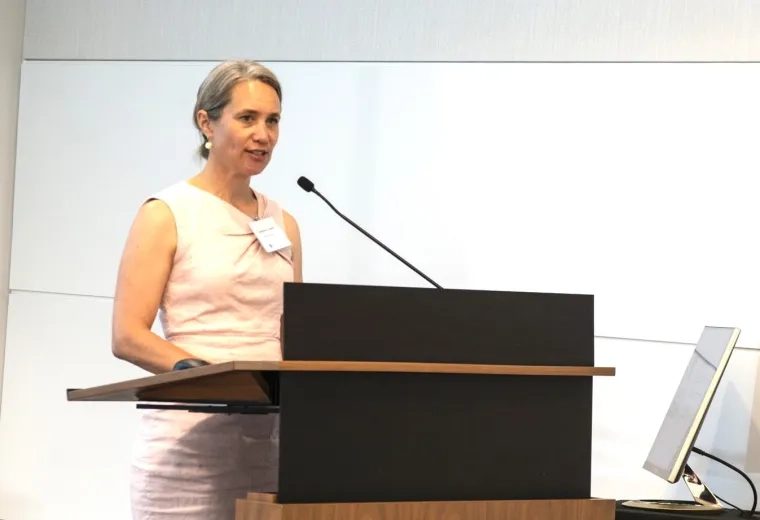 Woman speaking at podium 