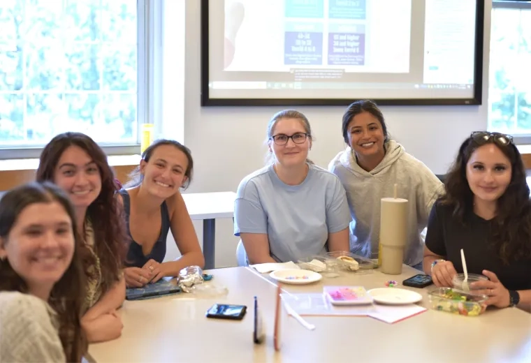 Six students smiling
