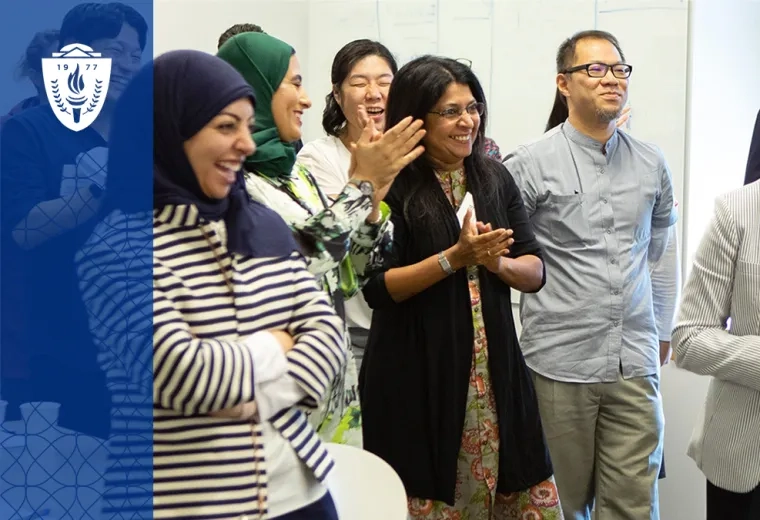 a mix of women and men of different ages and races stand in a group and smile