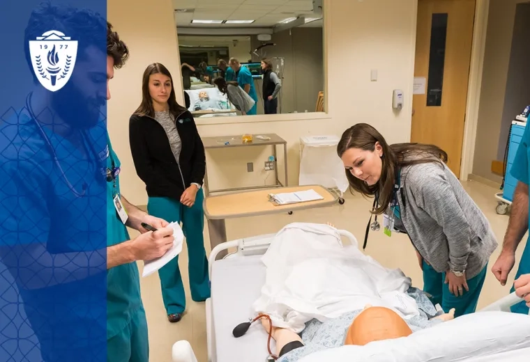people in scrubs examine a manikin in a hospital bed