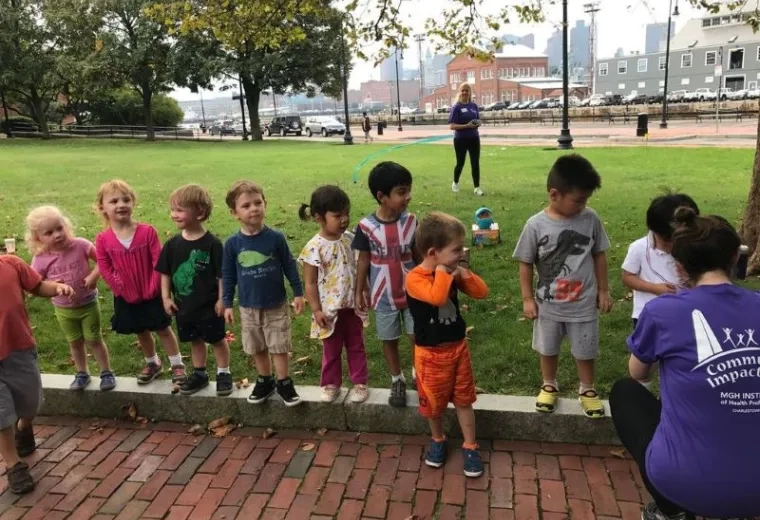 Children wait in a line to receive a medal