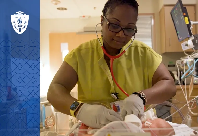 woman uses a stethoscope on a tiny baby in a hospital bassinet 