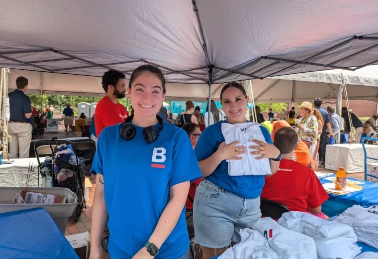 Students at the IHP Institute hand out t-shirts at the City of Boston's ADA Day event.