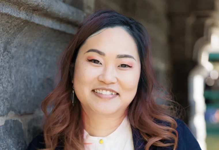 King Yan Kwok  wearing a white button up and a navy blazer