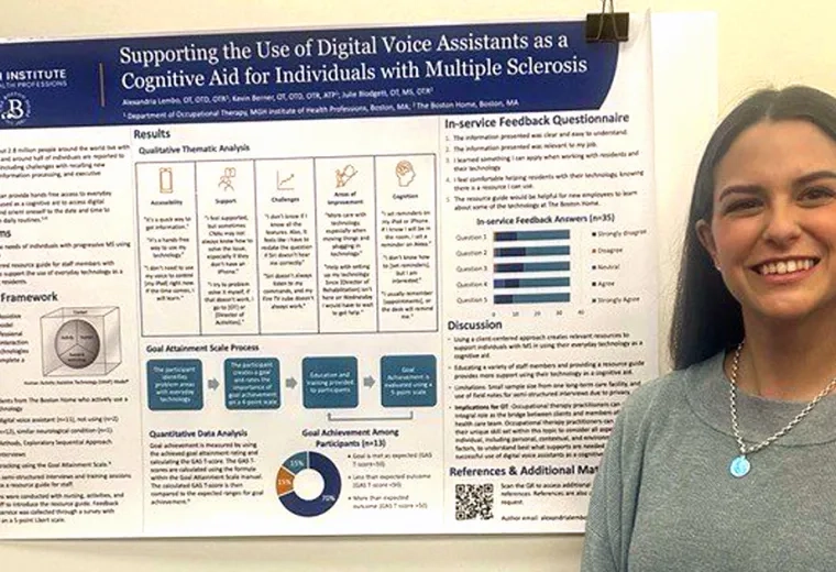 A woman stands in front of a poster at a research conference