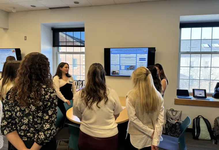 group of women around a tv