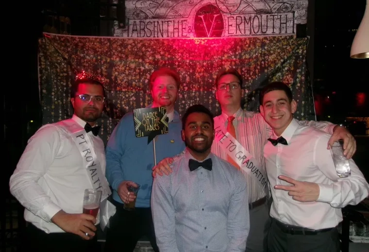 A group of 5 people posing for a photo