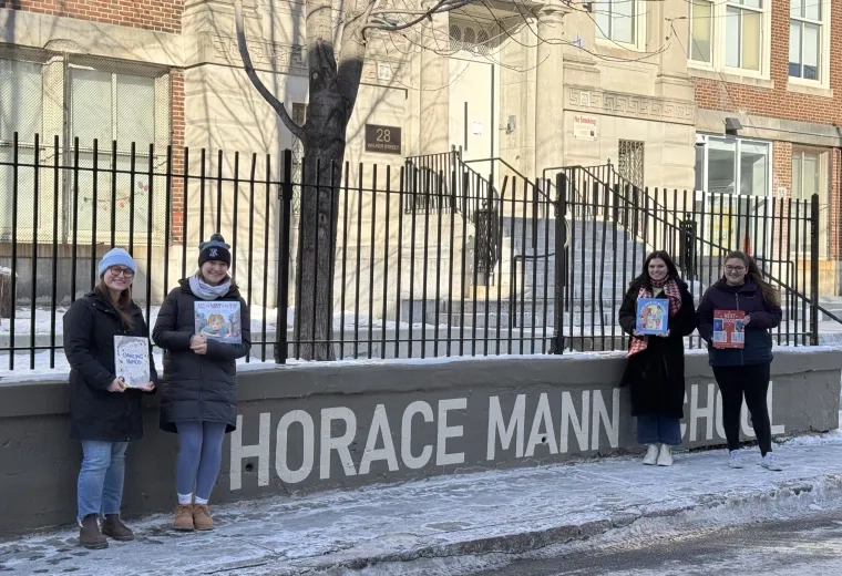 4 women in front of school
