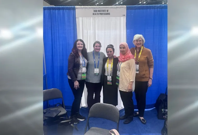 Five women standing in front of a blue and white curtain