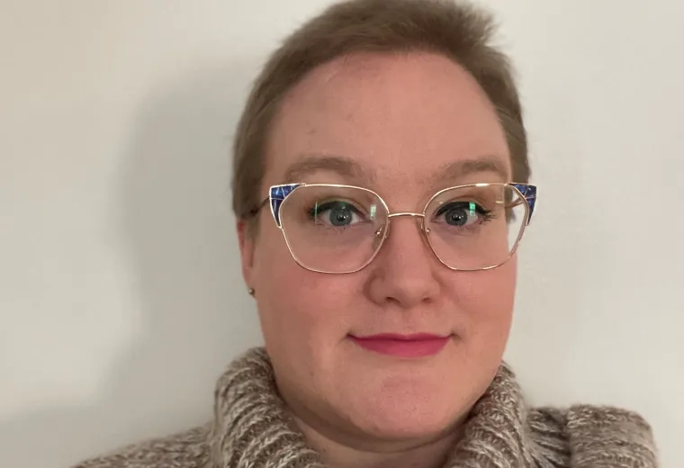 katie wears cat eye gold rimmed glasses