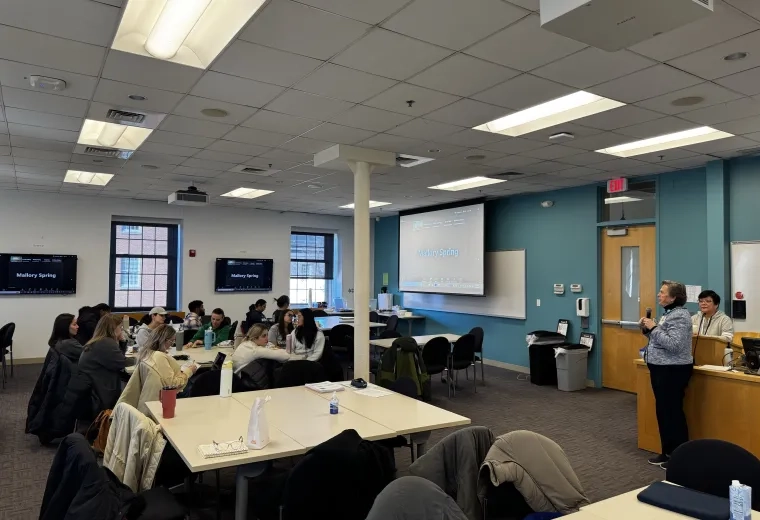 Two women answer student questions at Town Hall 