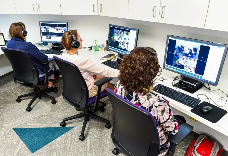 people monitor a screen to help assess students and set forth Individualized Education Programs (iep's)
