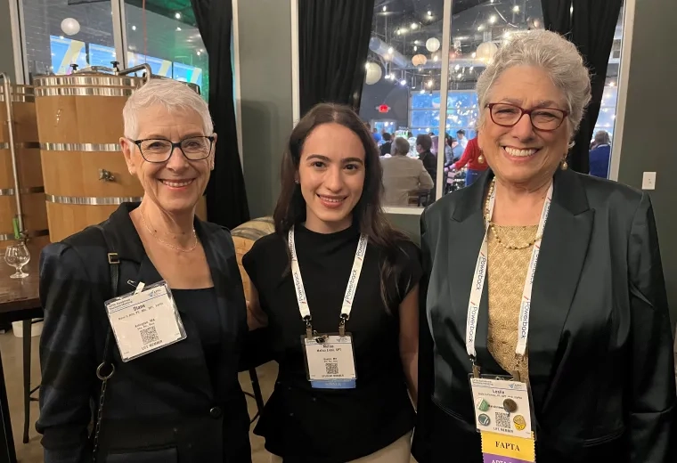 Three women pose for the camera