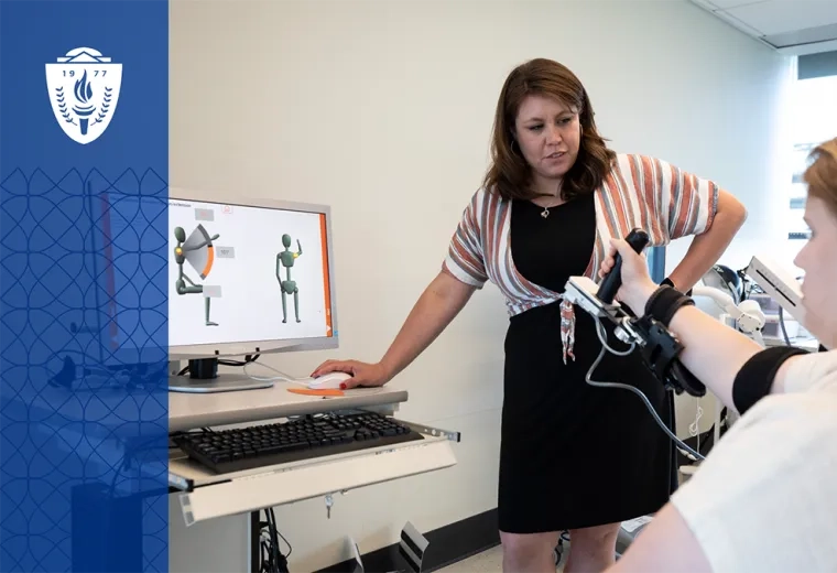 woman uses technology in occupational therapy robotic hand with computer program