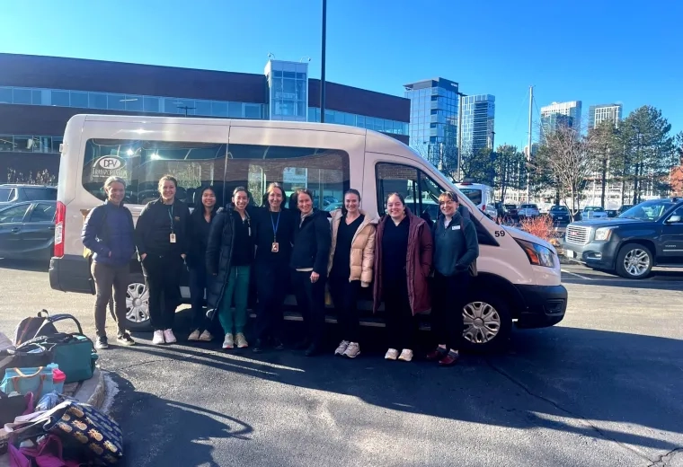 people standing in front of a van
