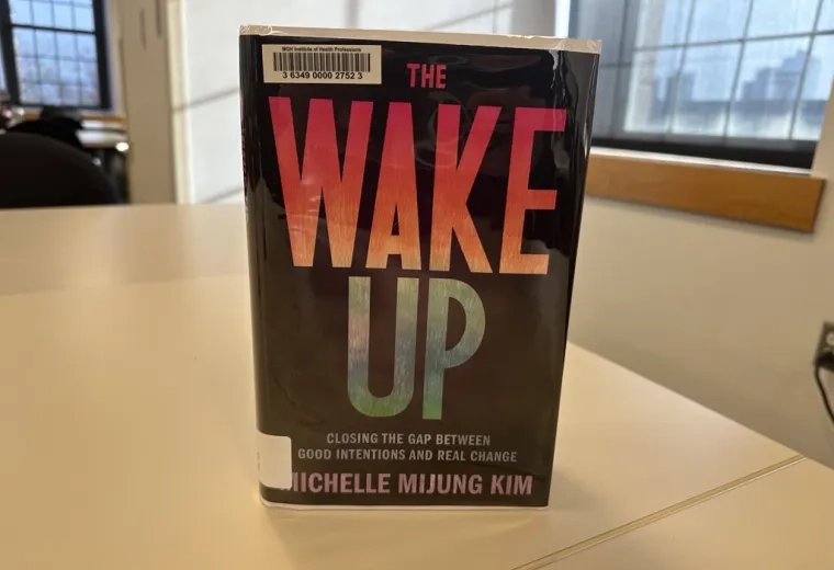 The book The Wake Up stands on a table