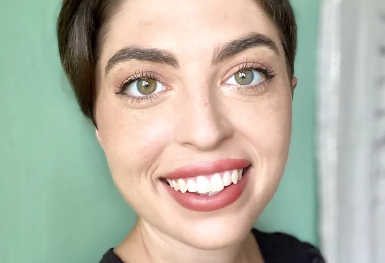 alex morton in front of a green wall