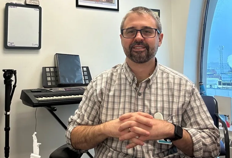 man sitting in front of his keyboard
