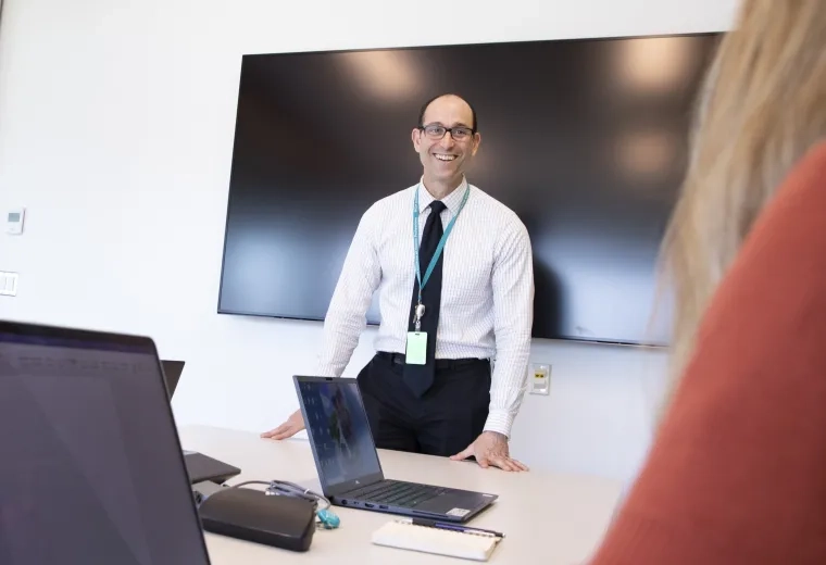 man standing and smiling 