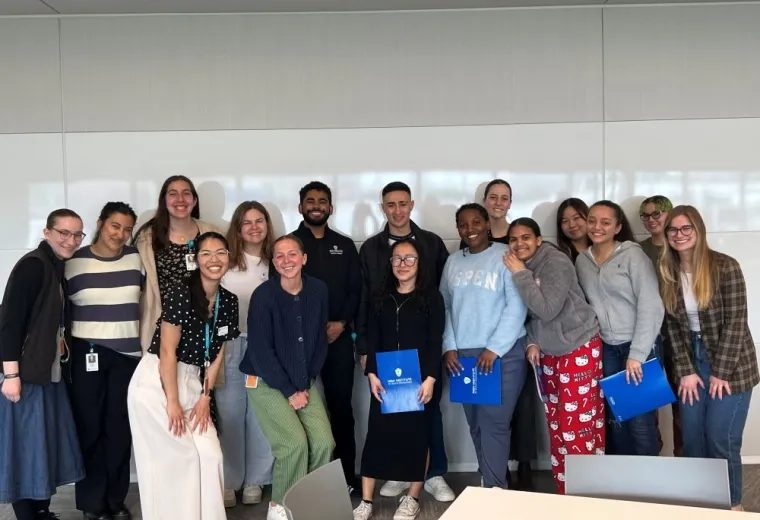 A group of people poses for a photo