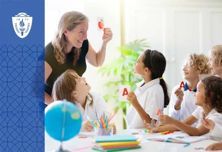 Teacher smiling and holding a drawing of an apple in front of four kids