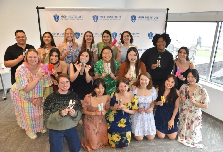 Large group of people holding knit items