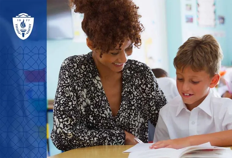 Woman sitting at desk with a child doing school work