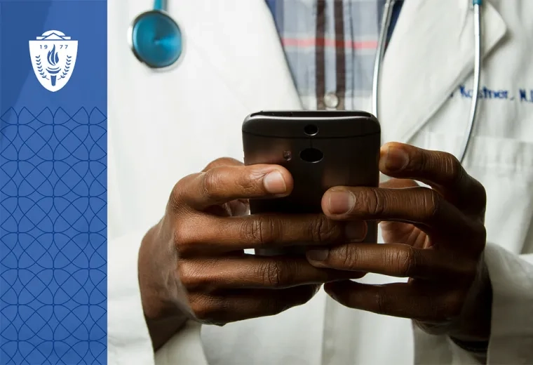 Close up of a doctor holding a smart phone in their hands.
