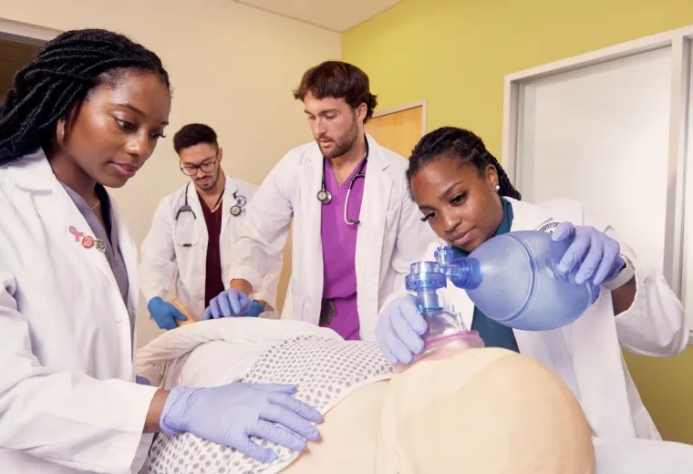 med school students around bed