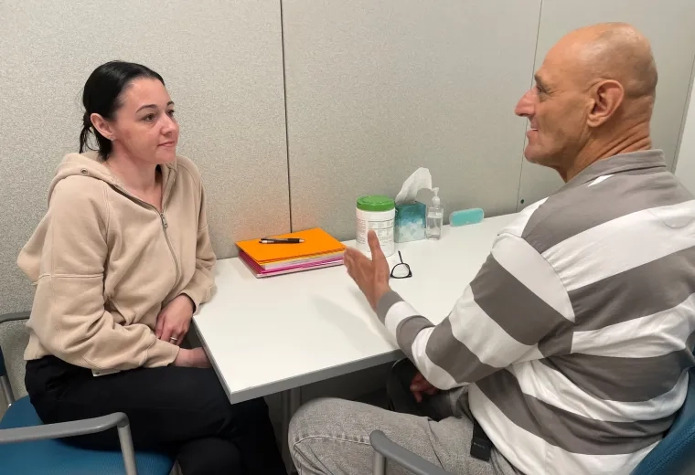 student working with client 