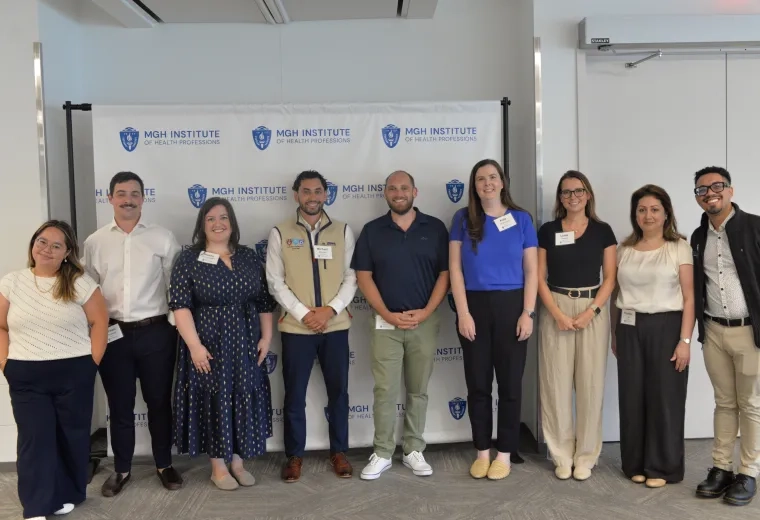 9 people in front of a background that says MGH Institute