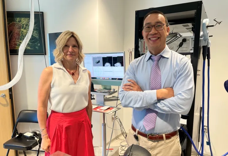 man and woman standing in lab
