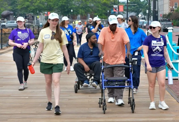 group of people walking on a path