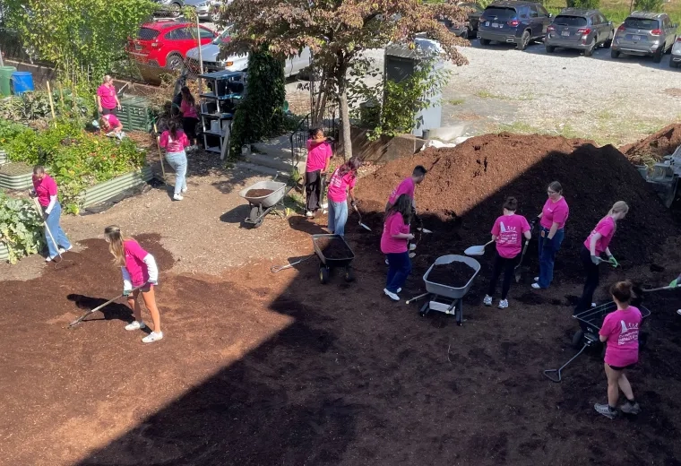 student volunteering at urban farm 