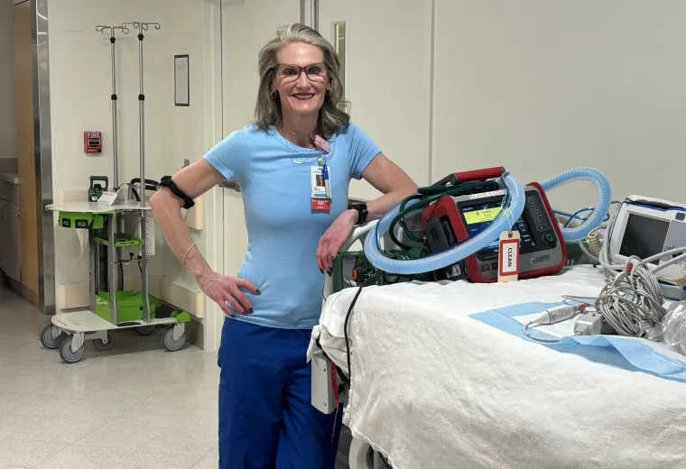 woman next to gurney 