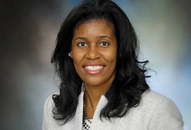 Professional headshot of woman in business attire