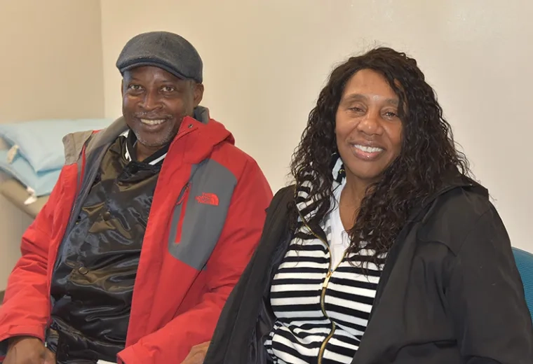 A man and woman sit next to each other