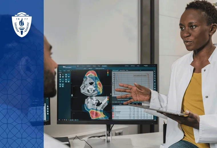 Woman wearing white lab coat standing in front of screen showing medical scans