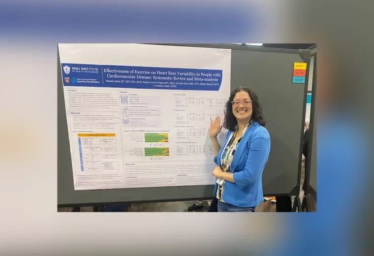 A woman stands in front of a board with a poster on it